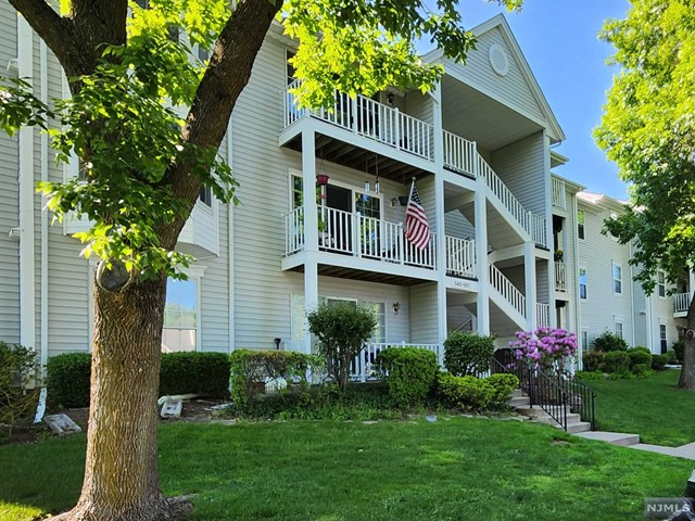 Welcome to your new home! This delightful 2-bedroom, 1-bath condo is nestled in the peaceful surroundings of Mahwah, offering the perfect blend of tranquility and convenience. Enjoy easy access to public transportation, top-rated schools, beautiful parks, diverse shopping options, and nearby houses of worship. The primary bedroom boasts a spacious walk-in closet, providing ample storage. The main living space features newish luxury vinyl flooring, adding a touch of elegance and comfort. Step out onto the charming deck and take in the serene views of lush trees and lawn - a perfect spot for relaxation. This condo also includes central air, ensuring year-round comfort, & is equipped with new kitchen appliances, along with a new washer and dryer for your convenience. Residents can take advantage of the excellent amenities, including a clubhouse, tennis courts, and a swimming pool. Plus, with low taxes and a low HOA fee, this property offers exceptional value.