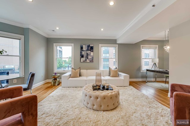 Welcome to the Historic Paulus Hook neighborhood of Jersey City. This stunningly spacious, well-equipped corner 2bdrm 2bath 1,210sf condo in a small elevator building, has everything you need to call home. Walk into your bright open kitchen dining/living room with additional office nook. Kitchen features stainless steel appliances with extra large chef's refrigerator freezer, gas range/oven, solid wood cabinets with granite countertops and eat-in island. Exceptional primary/master bedroom with seemingly endless closet space and an ample sized en-suite bath. The second bedroom is extra large and includes ample closet space as well. Hardwood floors throughout, NYC Views from every room and most importantly additional 3x5 storage room in the basement and gated deeded parking spot. Short distance from the Exchange Place PATH, Waterway Ferry and Liberty State Park. Easy access to shopping, dining, schools, doctors and houses of worship. Come see all Paulus Hook has to offer.