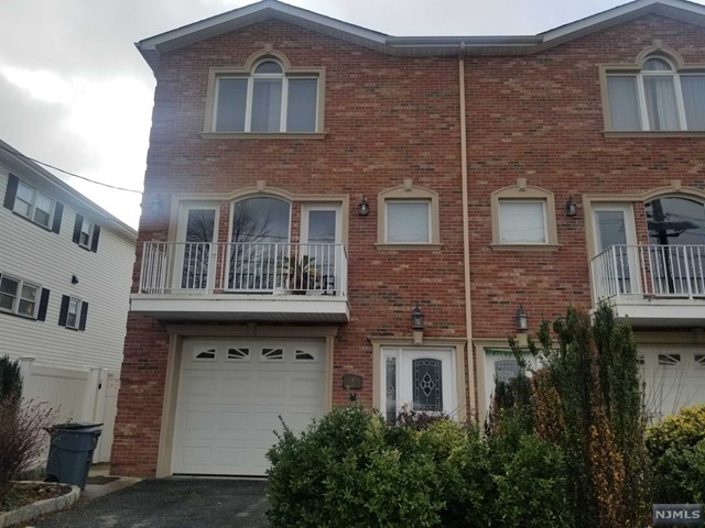 Custom brick townhome located on dead end street. Open and spacious layout. Features include living room with French door leading to terrace, hardwood flooring, recess lighting, MEIK with SS appliances, granite counter tops, center island, subway backsplash, over head vent and designer cabinets. Master bedroom with master suite (Whirlpool tub , Walk-in shower & double sink), roomy walk-in closet. Ground floor features a large family room/potential 4th bedroom with full bath and walk out to fenced private yard w patio. Attached car garage. 2 zone Central AC & Forced heat. Ample shared town parking in front of house. Close to NYC bus stop.