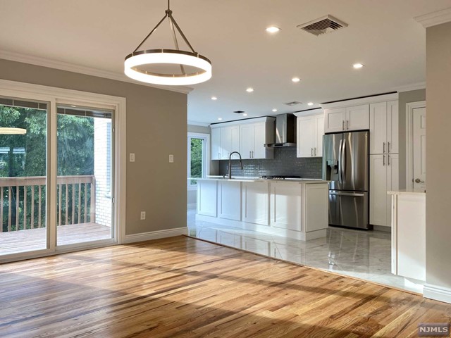 XL-Duplex in highly sought after neighborhood on the northside of Fort Lee on the border of Englewood Cliffs totally renovated in 2020. Large Primary Bedroom with en-suite spa-like bathroom, 2 additional bedrooms with full baths to share. Sun drenched living room, spectacular modern eat-in-kitchen, large deck off the dining room, 1 half-bath. Fully finished basement with a separate entrance to outside, perfect for a family room or guest bathroom suite with full bathroom. Hardwood floors throughout, skylights. Two-car attached garage. Incredibly spacious backyard. Close to public transportation. Walking distance to Blue-ribbon School #3. Owner is a NJ/NY licensed Real Estate Agent.