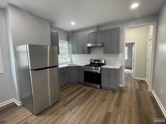 Welcome to this beautifully renovated apartment. Located on a quiet street of Belleville, close to shops, transportation, parks, restaurants & more! Unit on second floor which includes 2 bedrooms, 1 full bathroom, separate living space and eat in kitchen. Brand new windows in every room, new vinyl flooring throughout living/ sleeping spaces. Custom cabinets, quartz countertops & never been used stainless steel appliances! Updated electric & plumbing. New light fixtures, freshly painted a beautiful neutral color. Unit is bright, airy and spacious. Loads of closet space. Baseboard heating & window A/C. Street parking only. No Laundry. Pets may be considered ( call ). Tenants pay gas & electric. Landlord pays water & sewer. Credit report, background check, pay stubs & interview required. Coin laundry coming in the next 6 months !