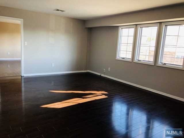 RENOVATED apartment in Prime Nutley Location! This SPACIOUS sun filled unit features gleaming hardwood floors, a large living room/dining room, kitchen with pantry, master bedroom with generous walk in closet and renovated master bath. A second bedroom also features its own oversized walk in closet. An additional hall closet is available for added storage. Freshly painted and available for immediate occupancy. One reserved parking space included. Landlord installed Washer /Dryer can be included for additional $150 per month. Only steps away from Mass transit!