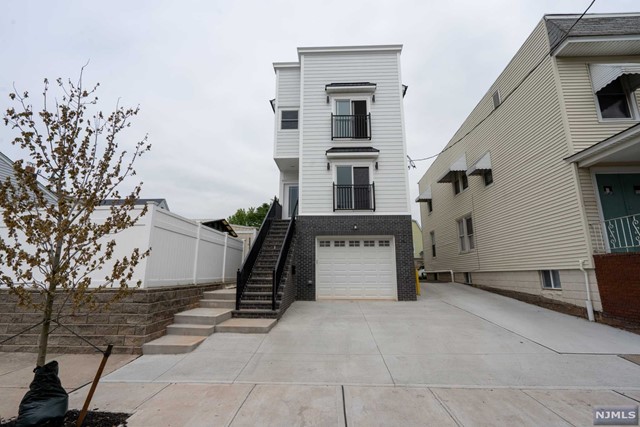 Looking for an ultra modern 2 year newer Construction unit located a short walk to the PATH? Look no further! This is a gorgeous move in ready apartment with 2 bedrooms, 2 full bathroom, and driveway parking, large combined dining and living room with a bonus nook great for an office space, spacious chef's kitchen with quartz counter-tops, stainless appliances Features central air, vaulted ceilings, master bed and bath with walk in closet, attic storage space with pull down stairs, and washer/dryer in unit! Walking distance to PATH, NJIT & restaurants. Only 20 mins to downtown/midtown NYC! Tenant pays broker fee. Close to major highways, parks, school, whole foods & other supermarkets. 1 car parking in driveway and backyard included! Inquire today!