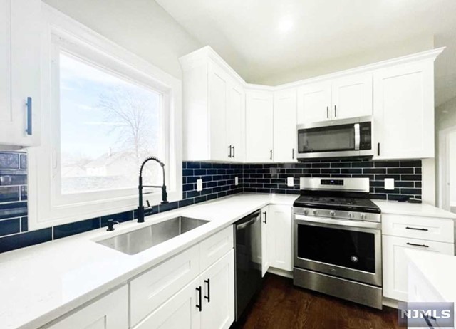 Listed by Wendy 917-504-3347 2nd floor apartment. A true renter's dream!! Wonderful opportunity to rent Beautifully renovated 3-bedroom 1-bath apartment located in desirable BERGENFIELD. This ready move-in apartment offers: hardwood flooring, high ceilings, tastefully appointed & fully equipped kitchen including S&S appliances, granite counter-tops, soft close cabinetry & center island. 3-bedrooms w/closets. Central air & heating, recessed lighting, full bath with double sink & soaking tub. Private use of yard. Private use of driveway for 2 cars(tandem) Within minutes to public transportation, schools & shops. Water is included. Tenant pays electric, heat & gas. Due at signing of the lease: 1st month rent + 1.5-month security deposit + 1-month broker's fee) NO PETS.