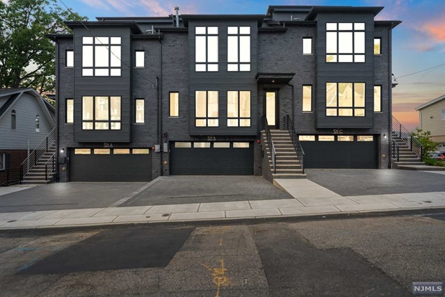 BRAND NEW OVERSIZED ALL BRICK CONTEMPORARY TOWNHOME FEATURING OPEN CONCEPT MAIN LEVEL W/ 9FT CEILINGS, LIVING ROOM ,DINING ROOM, MODERN GOURMET KITCHEN WITH OVERSIZED ISLAND, QUARTZ COUNTERS AND BACKSPLASH, GE CAFE APPLIANCES, FAMILY ROOM WITH LINEAR GAS FIREPLACE AND BUILT INS, DESIGNER POWDER ROOM, AND DECK OFF REAR WITH ALUMINUM RAILING SYSTEM...2ND FLOOR PRIMARY BEDROOM SUITE WITH SPA-LIKE BATH AND TWO WALK IN CLOSETS, 2 ADDITIONAL BEDROOMS BOTH WITH SHARED FULL BATHS...ROOFTOP LOFT WITH SITTING ROOM, WETBAR, AND HALF BATH AND PRIVATE TERRACE WITH INCREDIBLE VIEWS OF MEADOWLANDS...GROUND LEVEL COMPLETED WITH RECREATION ROOM WITH 12FT CEILINGS, HALF BATH, AND SLIDING GLASS DOOR TO YARD...ADDITIONAL FEATURES; EXTERIOR LIGHTING PACKAGE, CUSTOM TRIM/MOLDINGS, LED RECESSED LIGHTING, OAK HARDWOOD, PORCELAIN TILES, KOHLER FIXTURES, HIGH EFFICIENCY SYSTEMS AND MORE...STEPS AWAY FROM SHOPPING, DINING, AND NYC TRANSPORTATION.