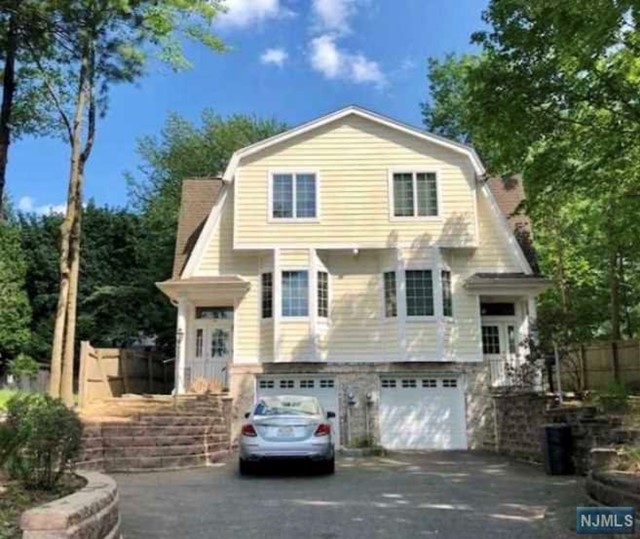 Located on the East hill of Tenafly, Hardwood floors, well maintained house, close to school and NYC bus stop and shopping, very bright and charming back yard,attached one car garage and wide driveway, please come and see !