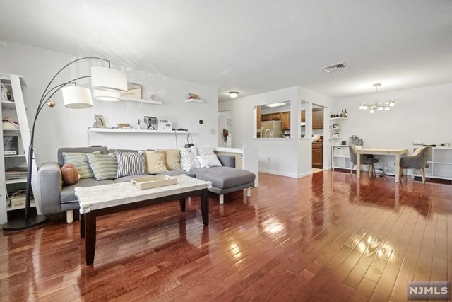 Beautiful 2 bedroom, 2 bathroom condo in the heart of Edgewater. This all south facing unit is in the quieter part of the Crown Village community. On the second floor of a low-rise building, this unit's entry foyer leads to an updated kitchen with stainless steel appliances and granite countertop. Large prime bedroom with walk in closet and ensuite bathroom with shower and tub. Second bedroom also face south with ample closet space. Hardwood floor throughout. Washer and dryer in unit. Central AC and heating. Very open layout with separated dining room and living room, large south facing terrace. Close to NYC buses and shopping including Trade Joe's and Whole Foods Market. One parking space is included, extra parking space is available for $35. Community amenity includes swimming pool and fitness room.