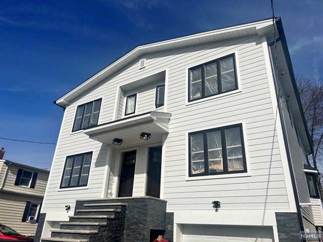 Welcome to this fabulous brand new construction duplex home (right side) featuring a very nice open layout and modern feel throughout. Great townhouse alternative with $0 monthly maintenance fee! Step inside to a stunning living room and dining room followed by gourmet kitchen with an island. Also, sliding door to rear deck and yard as well as powder room to complete first floor. The second floor features a spacious master bedroom with master bathroom and walk-in closets. Additional 2 bedrooms, full bath on the same level. Bonus ground level room great for entertaining and/or office with access to the garage and laundry room. Attached garage and driveway. Exceptional exterior finishes with stone and hardie plank, hardwood floors throughout and much more! Extraordinary quality of craftsmanship! Excellent for commuters - located less than a mile to Plauderville Train Station!