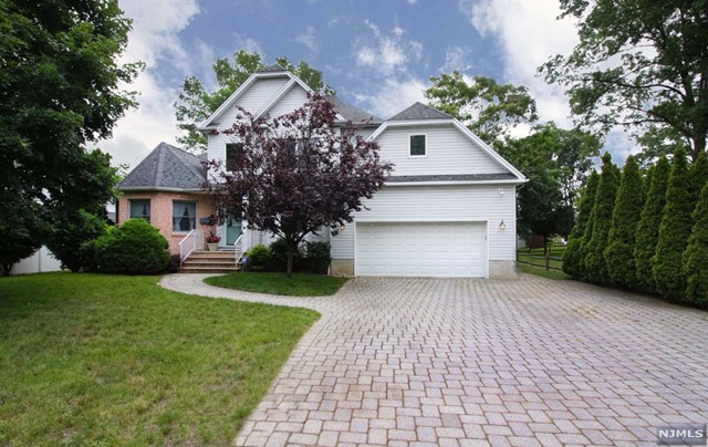 One of a kind young colonial built in 1998 with elegant charm and every modern convenience. A picture perfect home with more then 3100 sq ft features generously sized rooms, two story family room/living room with a fireplace, a fabulous kitchen with granite counters, Viking stove, top of the line stainless steel appliances and radiant heated floors. The master suite on the first floor has a vaulted ceiling and a master bath with a Jacuzzi tub. The second floor offers two large bedrooms, full bath with a room for an office or 4th bedroom. Full finished basement with a family room and a full bath, recreation and a utility room. This home is located in proximity to schools, NYC bus, downtown Ridgewood and park. Tenant is responsible for first $200 of minor repairs. NO PETS TENANT RESPONSIBLE FOR LAWN AND SNOW REMOVAL, MOVING CONDITION.
