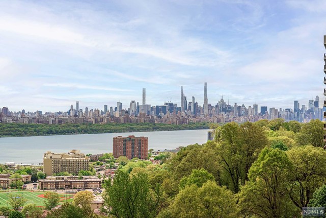 HORIZON HOUSE- Building 5, Residence 811. This meticulously maintained southeast facing 2 bedroom 2.5 bath co-op offers spectacular NYC, GWB, and Hudson River views. The sun filled home has a spacious floor plan, enclosed terrace, wonderful closet space all fitted by California Closets, and wood floors in pristine condition. An updated kitchen completes this offering. Full service luxury amenities include a 24-hr doorman, community room, gym, laundry, outdoor swimming pool, tennis courts, and public transportation just steps from the complex. Maintenance TOTAL including Garage Parking ($96), Cable ($48.90), Assessment ($320.83), and Base ($2526.08) is $2991.81. Maintenance includes property taxes and all utilities! Pool/Gym/Tennis are additional fees. An all cash purchase requires a minimum income of $144,000/year. Subject to board approval: Min 25% down, 4-to-1 Income-to-Debt Ratio.Contact FATIMA BULUR at 973-476-4655 or Fatima@ChenAgency.com