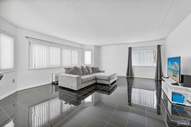 Gorgeous 1st floor 2-bedroom Condo Pet friendly with parking included on quiet, picturesque street with large walk-in closet, modern kitchen w/ stainless Steel appliances, and in-unit laundry. Home features a spacious & accommodating layout with large over-sized bedrooms, beautifully renovated bathrooms, and a separate dining area. Easy to show with a fast and flexible move-in. 12-month lease and longer available. Second parking spot available for a fee.