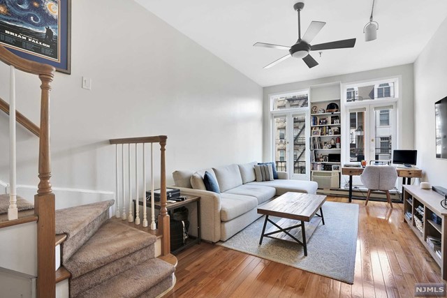 Welcome to your terrific east facing one bedroom Duplex with pristine hardwood floors, soaring 12' vaulted ceilings, Kitchen Breakfast bar with stainless steel appliances overlooking expansive living room that leads to your private terrace flooded with natural sunlight. Journey upstairs to a private bedroom with 4 large closets and renovated bathroom with skylight. Custom window shades throughout.