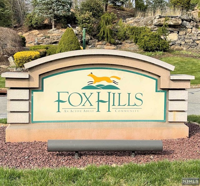Welcome to Fox Hills 55+ Gated Community with 24 hour manned security. Beautiful condo in the Jefferson building. Freshly painted, 2 bdrm, 2 bath end unit! Windsor E model with 1837 s.f. of elegant open space on second floor of elevator building. Features include a spacious living / dining room with wood floors. Sliders to a spacious deck. Eat-in-kitchen with plenty of cabinet space. Spacious den. 9 x 6 Storage unit in garage. Assigned parking in garage no. 68 with add'l parking outside. Water heater is 1 year new. Enjoy the fabulous 26,000 sq.ft. Clubhouse with indoor & outdoor pools, gym, shuffleboard, bocci, tennis courts. Free jitney to mall & food shopping.