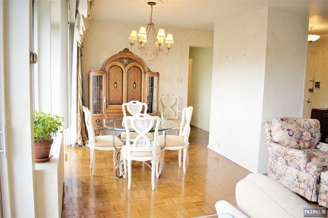 MOTIVATED SELLER!! Welcome to a Luxury Co-op Community on 32 acres in the Heart of Fort Lee. 843 square ft 1 bedroom unit, with beautiful sunset views. Boasts of beautiful parquet floors and a large living/dining area with a balcony that spans the entire length of the living room with a retractable awning. Unit also comes with an indoor parking space! The grounds also have 2 outdoor pools, tennis courts, playgrounds, fitness rooms, BBQ area, bagel shop/deli and more! Monthly maintenance includes all utilities,taxes,U/L mortgage,and indoor parking.total $1510.67(Maint$1202.44,Parking $96,Cap. Assess $163.33,Cbl/Int $48.90) Board approval required 4:1 DTI, 20% down. All offers must be submitted with top two pages of the last two years tax returns, credit report with fico score, asset statements, bank statements. proof of funds.