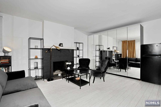 Condo for rent - luxury NYC living in the best building & prime location of East Hill area of Englewood - Dwight Manor in the picturesque park with manicured lawns! 10 min drive to NYC for a fraction of NYC cost of renting an upscale condo! NYC, local buses out front. Stunning sun drenched fully renovated apartment in a secure historic building in the heart of Downtown Shopping & Restaurant District offers open concept - new gorgeous kitchen, dining & living rooms, stunning white floors, walls of closets totaling 7, large new bathroom with a closet, spacious bedroom, intercom, wood burning fireplace, 9 ft ceilings, large windows. Listed as 1st floor, but in fact, it's second floor because 1st floor is ground floor, & this apartment is NOT on the ground floor. Elevator. Parking space included in rent. Laundry. Gym. Next to the library, Bergen Performing Arts Center, hot & regular yoga, New York Sports Clubs, Shoprite, Englewood Hospital, parks, Houses of Worship, best restaurants!
