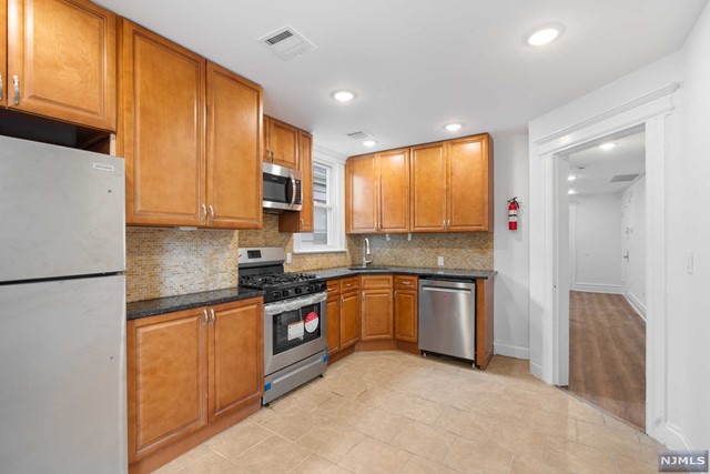 Welcome to your new home! This recently renovated second floor apartment offers a perfect blend of modern amenities and convenience in a prime location. With three spacious bedrooms and two full bathrooms, this home features brand-new stainless-steel appliances in a modern kitchen, forced hot air and central air, and an outside balcony. Enjoy easy access to public transportation, schools, and outdoor activities at Watsessing Park.