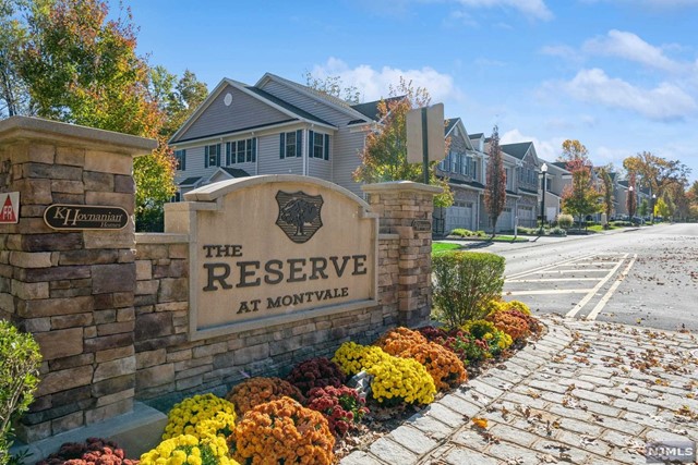 Welcome to "THE RESERVE" at Montvale. Secluded, but close to all the shopping and convenient to all major hwys. Elegance abounds in this unit. Entry foyer with full bath leads you to the Living Room graced with a gas fireplace complete with mantel. Open concept Dining Room and Kitchen lends to entertaining with ease. Step out for alfresco dining onto your patio in a parklike setting. Kitchen is complete with granite countertops, tiled backsplash, and SS appliances. Spacious mudroom from garage is equipped with coat closet, pantry, desk and utility closets. Head upstairs to your Master suite, dramatic tray ceiling, WIC w/custom organizers, bath with walk in shower and double vanity. 2nd bedroom, full bath and laundry room completes the 2nd level. Includes custom blinds and security system. Maintenance free living and convenient to all awaits you at The Reserve>