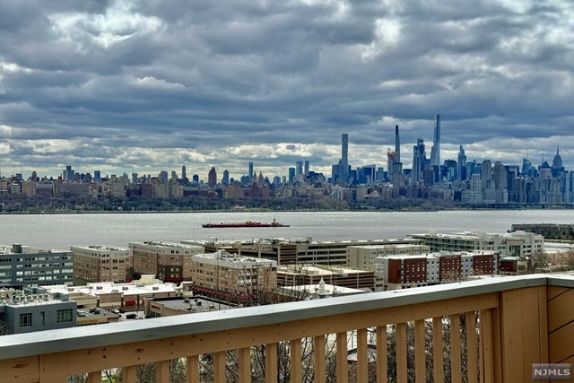 Welcome to this amazing town house with a stunning view of Manhattan skyline. This duplex offers a modern open floor plan for today's busy lifestyle. First floor opens up to a good size dining room, a eaten kitchen and a living room with a wood burning fireplace that leads to a balcony overseeing NYC skyline. Second floor offers a master bedroom with its own bath, two other bedrooms, a hallway bath and a plenty of closet space. This duplex also features one car garage and laundry. Located just minutes away from NYC transportation and few miles from midtown Manhattan this is a commuter delight location. Pets Conditional.
