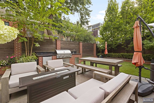Path Perfection: Your Dream Haven Awaits! Indulge in the epitome of luxury living just moments from the PATH, where elegance meets convenience. This steel and concrete masterpiece, spanning 3,215 square feet, offers a harmonious blend of modern sophistication and timeless comfort. The 4-bedroom, 3-bathroom duplex welcomes you with an expansive open-concept layout, integrating the living room, dining area, & a gourmet kitchen designed for the discerning chef. The primary suite is your personal sanctuary, featuring an opulent en suite bathroom with spa-like amenities and a soaking tub. Two spacious walk-in closets offer a haven for your wardrobe, ensuring every detail is perfect. The additional three bedrooms are thoughtfully appointed, providing comfort and flexibility. Each bathroom continues the theme of luxury, showcasing premium finishes. *Please note the home is 2,018 sqft plus additional 1,197 sqft of private indoor bonus garden room. Buyers to perform their own due diligence