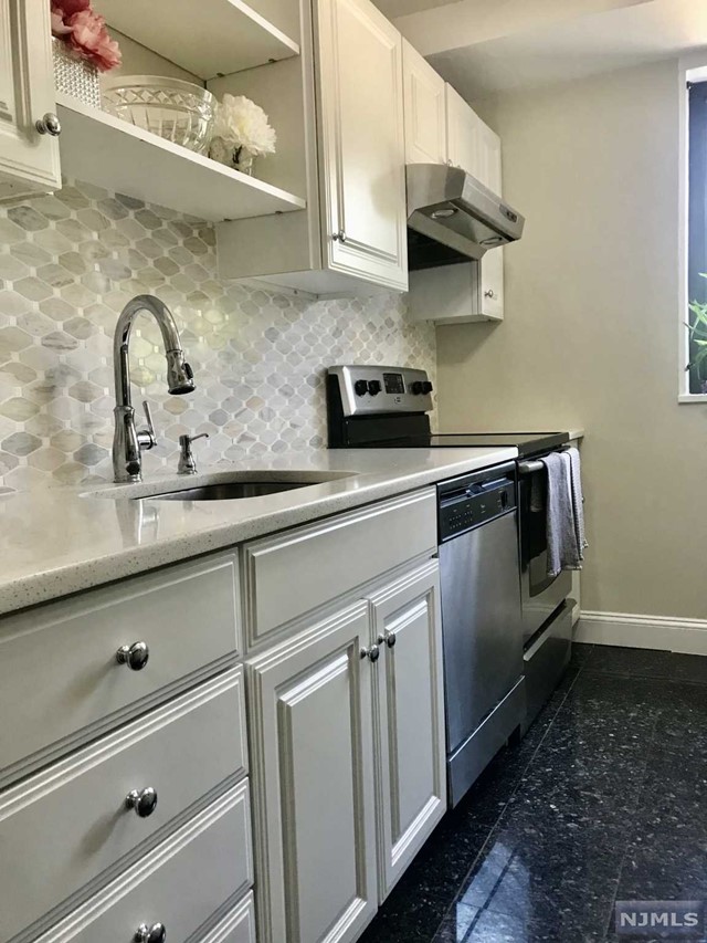 Large sun-filled 1 bedroom updated condo in the heart of Hackensack. With an open concept living / dining room, hardwood floors, enclosed terrace, a brand new beautifully renovated modern kitchen with white quartz countertops, this unit will not last! Perfect for commuters, bus stop outside front door and close to NYC train. Low taxes & Maintenance includes utilities - Electric, Heat, Hot Water and One Outdoor Parking Spot (#11) included.