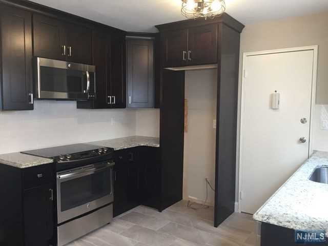 RENOVATED LARGE 1 BDRM UNIT IN QUIET SECTION OF RIDGEMONT GARDENS CONDOMINIUM COMPLEX. LAUNDRY AND STORAGE UNIT LOCATED IN THE SAME BUILDING. HEAT, WATER AND HOT WATER INCLUDED. TENANT PAYS ELECTRIC. NEWER KITCHEN WITH STAINLESS STEEL APPLIANCES (SS REFRIGERATOR WITH ICE MAKER INCLUDED), GRANITE COUNTERTOPS AND TILED BACKSPLASH. NEW DOORS, CROWN MOLDINGS, LIGHT FIXTURES, CUSTOM BLINDS AND BEAUTIFULLY REFINISHED HARDWOOD FLOORS THROUGHOUT. LARGE BEDROOM WITH 2 CLOSETS. 3 ADDITIONAL CLOSETS. TWO ASSIGNED PARKING SPACES CLOSE TO THE ENTRANCE. WALKING DISTANCE TO NEW YORK CITY BUS, CLOSE TO ALL MAJOR HIGHWAYS AND TRAIN STATION. NO SMOKING, NO PETS. RENTAL INSURANCE REQUIRED. OWNER HOLDS NJ REAL ESTATE LICENSE. AVAILABLE AUGUST 1ST.