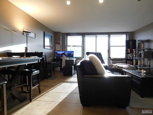 WOW..ONE OF THE LARGEST 1BRS IN THE BUILDING! FROM THE MOMENT YOU WALK IN, YOU WILL LOVE YOUR RENOVATED KITCHEN W/GRANITE COUNTERS, STAINLESS STEEL APPLIANCES & OPENS TO YOUR LIVING RM MAKING IT PERFECT FOR A SMALL BREAKFAST BAR! OPEN & AIRY LAYOUT WITH CUSTOM CERAMIC TILE FL! YOU ALSO HAVE A RENOVATED BATHROOM W/MARBLE FL! YOUR SPACIOUS BEDROOM HAS A HUGE WALK-IN CLOSET! THERE IS ALSO A HUGE WALK-IN CLOSET IN YOUR ENTRANCE FOYER AS WELL AS A LARGE LINEN CLOSET PLENTIFUL CLOSET SPACE! IN THE EVENING, YOU CAN ENJOY ROMANTIC SUNSET VIEWS FROM YOUR HUGE BALCONY WHICH ALSO HAS SUNNY, MOUNTAIN VIEWS BY DAY! YOUR WASHER/DRYER IS RIGHT IN YOUR UNIT..AND YOU HAVE A COVERED,ASSIGNED PARKING SPACE IN THE GARAGE..NO BRUSHING SNOW OFF YOUR CAR! THE MILL IS A FULL SERVICE COMPLEX W/SWIMMING POOL, RENOVATED GYM,2 TENNIS CTS,JOG/WALKG PATHS,SECURITY & APPX 12 ACRES OF PARK-LIKE GROUNDS TO ENJOY THE SERENE RIVER & WATERFALLS VIEWS! THE NJT TRAIN IS 2BLKS/BUS@CORNER! YOU WILL FALL IN LOVE!
