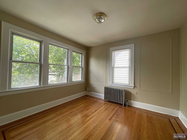 Renovated apartment in the heart of Newark. Featuring two spacious bedrooms and one full bath, perfect for comfortable living. The kitchen is designed for both functionality and style. An additional office space provides the perfect environment for remote work or study. Enjoy the elegance of wood flooring throughout. Don't miss out on this incredible opportunity to make this apartment your own! Schedule a viewing today!