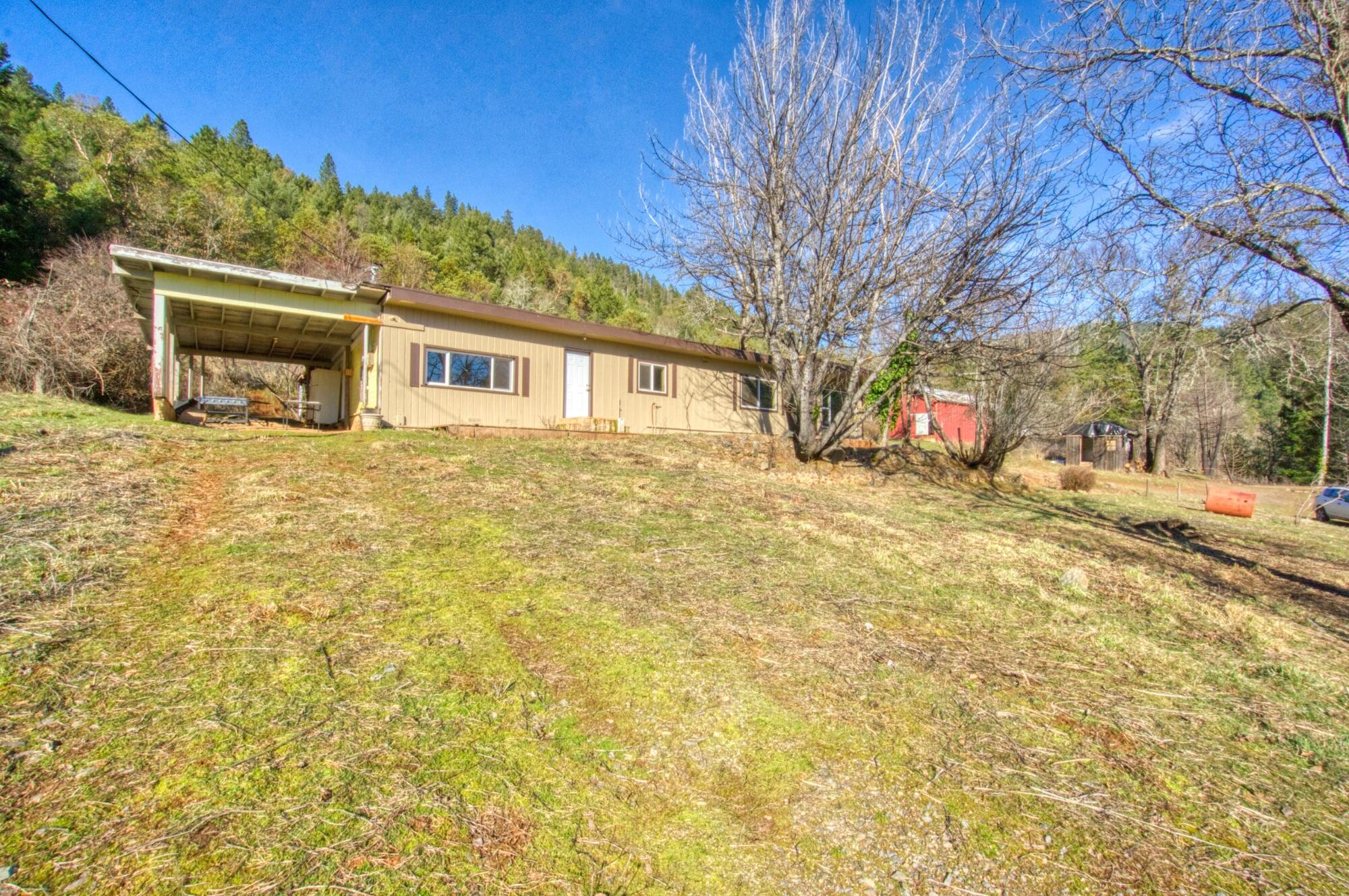 Looking for privacy? This 3 bed 2 bath home on 39.52 acres has been updated with new exterior paint, electrical panel and roof. There is a possible future building spot up past the gorgeous large pond with amazing views. There are 3 out buildings, a slab to build another storage or barn, southern exposure and an abundance of marketable timber or firewood. Could be a self sustainable farm as it was in the past.
As-Is