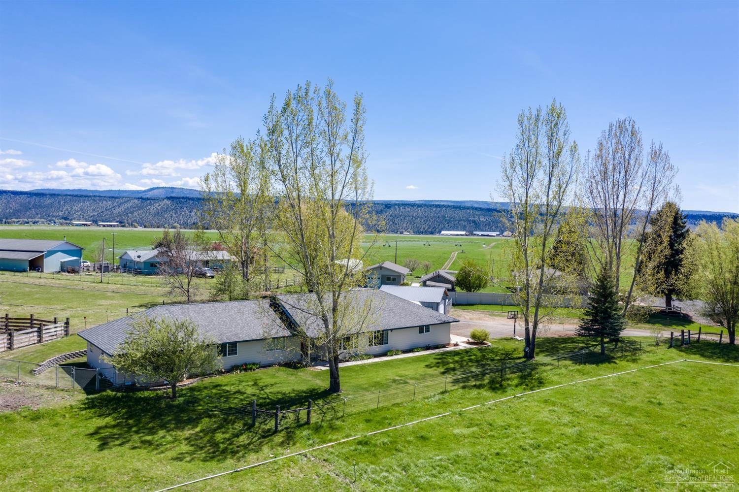 Perfect hobby farm nestled in the rolling hills of NE Prineville. Sprawling single level home w/ two Master Suites, 2 guest rooms & 3 full baths. Plenty of space to entertain with 2 spacious living areas & a traditional Kitchen that extends to the outdoor patio. Vaulted great room, tile, wood & carpeted flooring. Master Suite features a huge walk in shower, dbl sinks, lg linen closet & oversized closet. Space for a sitting area to enjoy the pastoral views from inside. Extended double car garage & detached shop w/220, great RV parking & toy storage! Irrigated acreage is fully fenced & cross fenced for a great hobby farm setup or 4-H projects. Don't want the hassle of irrigation but love the green space? Pasture currently leased out & willing to continue. Call for a showing!