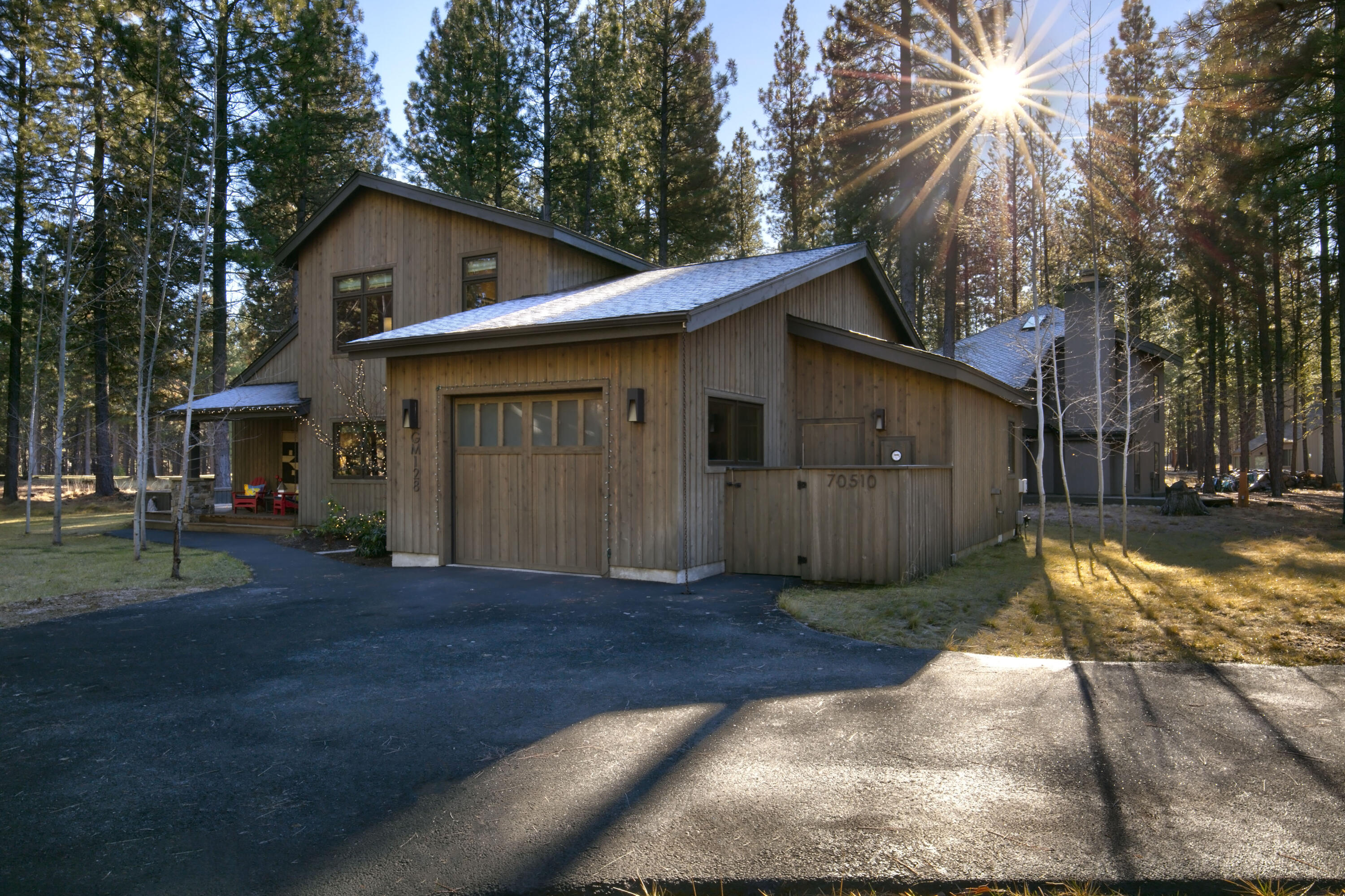 Don't miss this stunningly remodeled home in BBR. Updated in 2016, the home features four spacious bedrooms, each with an en suite bathroom, including a primary suite conveniently located on the main floor. The open-concept design allows the kitchen to flow into the great room, perfect for entertaining. The gourmet kitchen boasts soft-close cabinets, a six-burner propane range, soapstone countertops and a white glass backsplash. An oversized island includes a second sink and seating for four, while the entertaining bar has a beverage refrigerator. The bright great room, with floor-to-ceiling windows, offers stunning golf course views and a cozy propane fireplace. Step outside to the cedar deck, ideal for outdoor enjoyment. The garage features a finished attic for storage and a 240V outlet for EV charging. Overlooking the 7th fairway of Glaze Meadow Golf Course, this home is a short distance from the pool and recreation center. Schedule your viewing today!