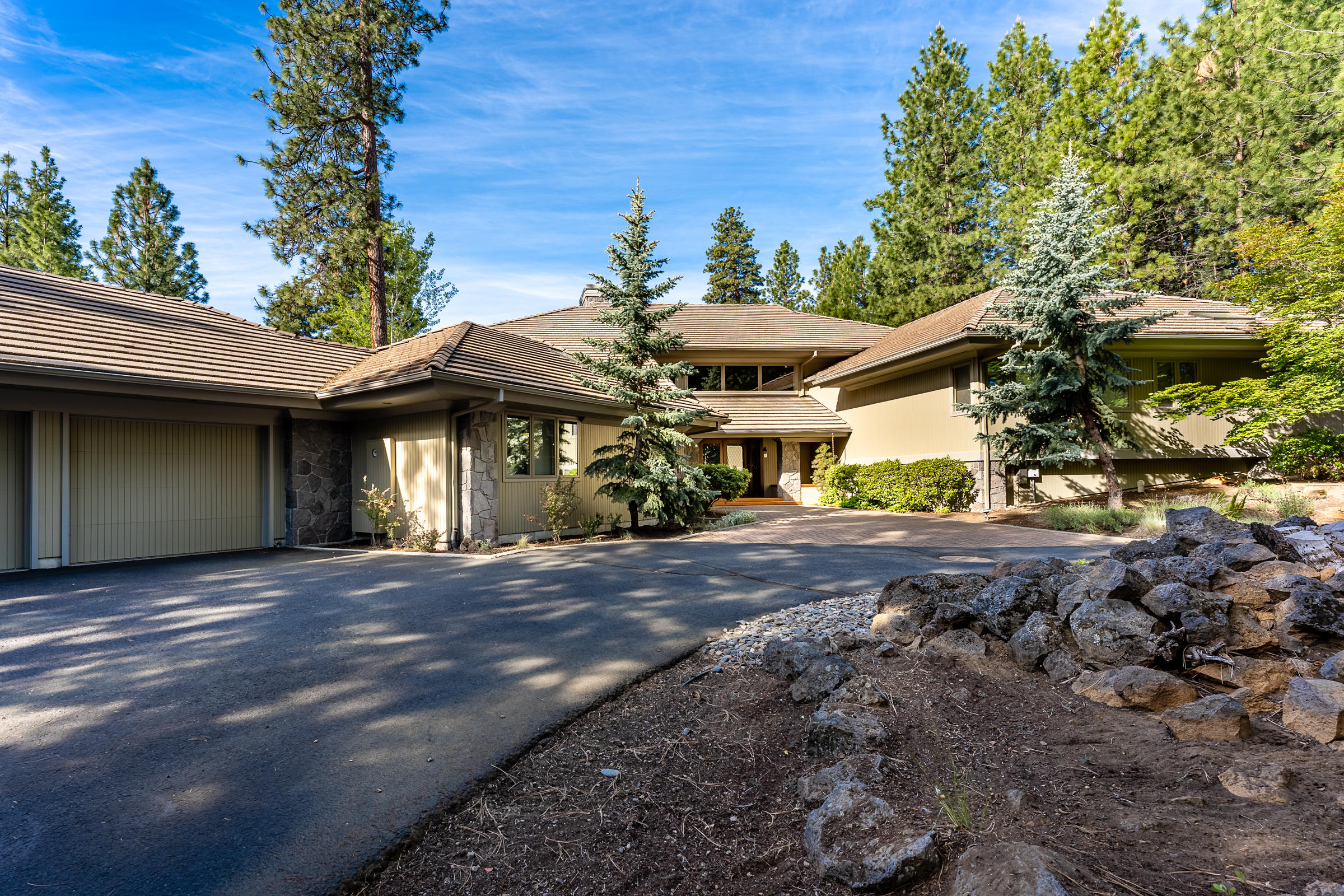 Stunning 4610 sq.ft home in Black Butte Ranch. This house, with 4 en suite bedrooms and an en suite office (all bathrooms have radiant floor heat), & a yoga room has been completely remodeled. The just under an acre & a half land sits at the far side of Black Butte Ranch and looks out onto forested property that is in a trust making the house private, quiet and serene.  Open floor plan with high ceilings, a gourmet kitchen, a wood burning fireplace in the living room & newly furnished decks all across the back of the house for the ultimate in-home entertaining. Immaculately kept and maintained – freshly painted in 2019. Limestone and wood floors. Skylights and large scale windows and sliding doors create natural light throughout. Beautifully landscaped with old growth trees & rock outcroppings. Oversized garage. 3 Heat Pumps, 3 Furnaces, 3 Water Heaters & radiant floor heat. This house & property is special – the ultimate in Black Butte Ranch and Central Oregon living.