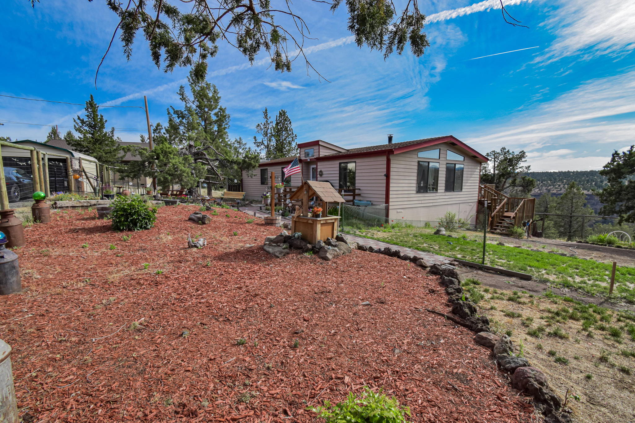 Would you look at those mountain views! Right off your porch, enjoy the beautiful peaceful view of the Sisters mountains. If you have been looking for your own affordable slice of central Oregon this is it. This home features vaulted ceilings, large master suite, lots of light, skylights, a open concept and has had some updates. A brand-new septic system was installed just over a year ago and the HVAC system has also been updated in the recent past. On the property you will find a metal car port, hobby shed, and a fenced garden. Only 15 min to HWY 97! Don't miss out on your own slice of the Central Oregon life.