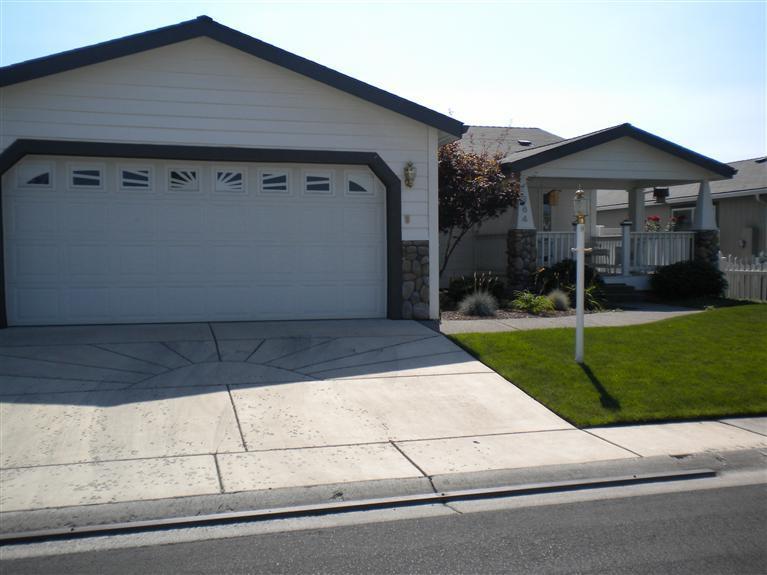Come home and enjoy the good life in this well cared for manufactured home in Miller Estates premier 55+ manufactured home community. Awesome floor plan with tons of windows, large kitchen w/built in eating bar/cabinets galore/gas fireplace. 3B/2B w/soaking tub and shower in master bedroom. Separate utility room, 2 car garage/vinyl fenced yard, covered patio with privacy. Park amenities include a beautiful park along the creek for park owners/families.