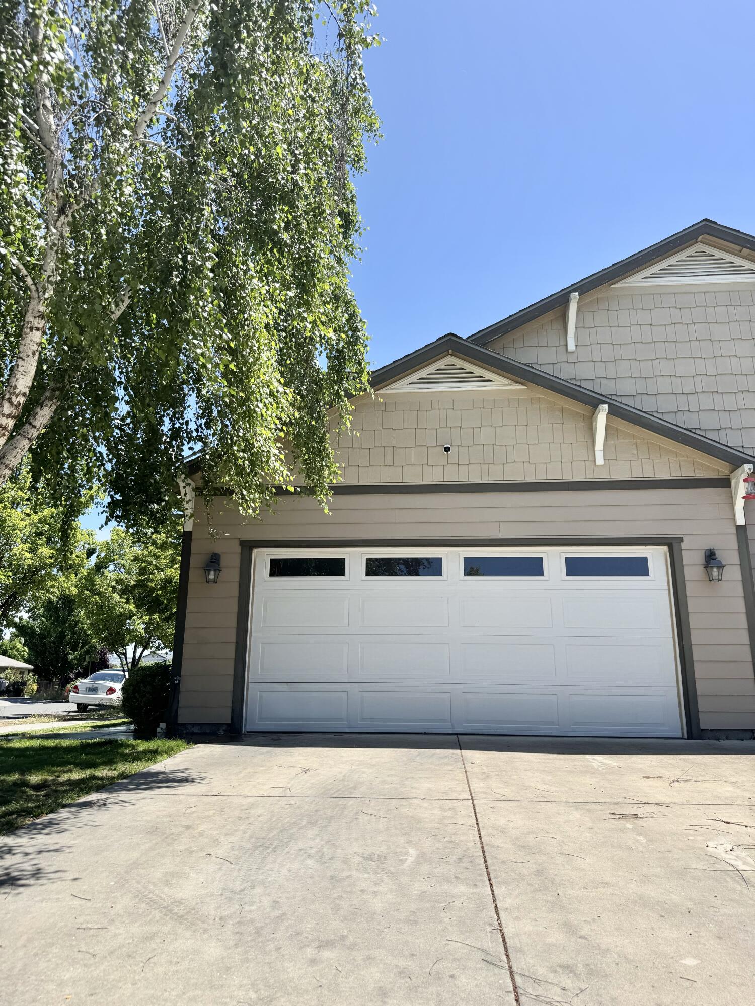 Delightful 3-bedroom, 2.5-bath home, crafted in 2010 and meticulously maintained inside and out. Boasting approximately 1,633 sq ft of thoughtfully designed living space this residence is a perfect starter home or a  move-up home for a growing family. This home offers:: Open-concept design with abundant natural light : perfect for entertaining or cozy family living. Chef's Kitchen: Featuring slab granite countertops, sleek wood cabinetry, and full stainless-steel appliances - move-in ready and stylish. You'll find a warm, Inviting  fireplace in the living area, creating a cozy focal point for gatherings.Serene Primary Suite: Spacious master bedroom upstairs, complete with generous closet space and private bath. Double-pane windows, central air, natural gas heat, and full perimeter. A fully fenced, low-maintenance yard with sprinklers and room for pets, entertaining., and Outdoor Enjoyment. Enjoy quick access to shopping, dining , Medford Airport and I5