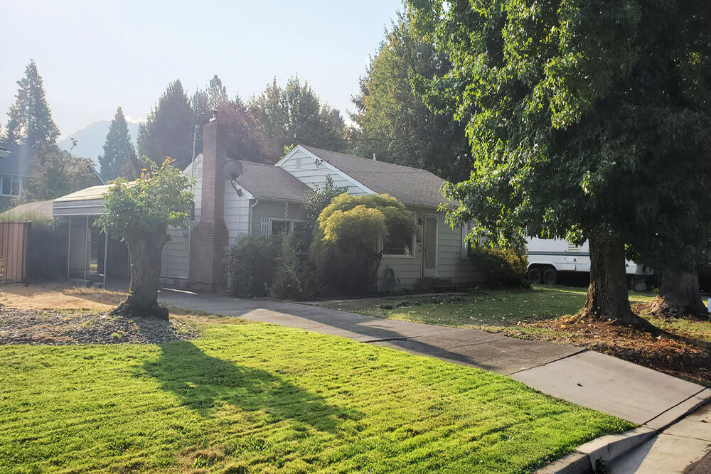 Tenant gave Notice to be out 12/31! Now's your chance to buy before Seller puts in a new tenant. Inspections performed! Adorable 50's Bungalow, a Quiet Tree Lined Street, Cute Curb Appeal & Big Backyard. Convenient Location Tucked Away in Town. Character & Quality: Wood Lap Siding, Brick Fireplace, Tight Grain Oak Floors (under carpet); Built-ins, Ample Cabinetry & Counterspace in Good-Sized Kitchen, Breakfast Nook w/ Vintage ''Pull Down'' Light; Pony Wall & a Brick Step-Down separates Liv. Room from Sunken Fam. Rm & Large Screened in Patio. Upgrades: Circuit Panel, Natural Gas Furnace Forced Heat & Air, Cozy Woodstove Insert. Ceiling Fan & Solar Tube. Chain link Dog Run. Beautiful Backyard: Lilac, Plum, Evergreen, Huge Japanese Maple. Irrigation from GPID! Sprinklers front & back. Finished Storage Room w/ Power. 2 Carports. Concrete Driveway fits 4 Cars. .23 of acre! *Might be able to add ADU or Divide! See City/Buyer do Due Diligence. Home Warranty!
