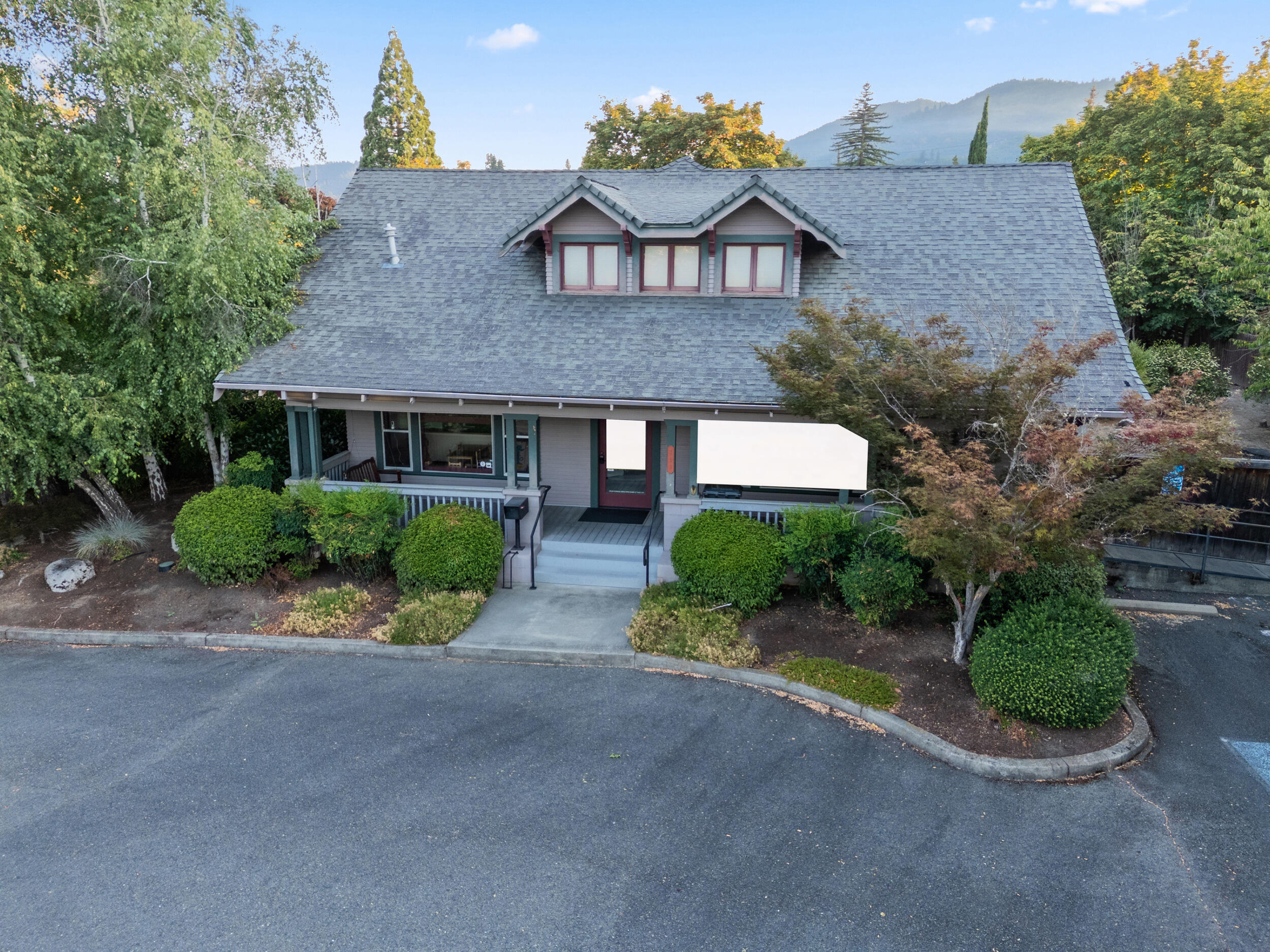Great location for Office/Medical on well-traveled A St in Grants Pass. This ca. 1900 residence has undergone multiple adaptive reuses, previously converted to office use, and most recently used as a licensed day-care facility. Features include a designated reception area, several offices/rooms, a downstairs bathroom, and a functional upstairs with a second bathroom and multiple rooms that may serve as offices or additional program space. There is also an outside back deck with stairs leading to yard and a welcoming front porch. The property sits on nearly half acre lot with paved parking with room for expansion. Located in a predominantly residential area along a major thoroughfare supporting office/medical/daycare, the site is within close proximity to both an elementary and a high school, supporting its continued use for childcare or other neighborhood-serving functions. The current lease expires March 31, 2026. Renew lease at market rent or owner occupy.