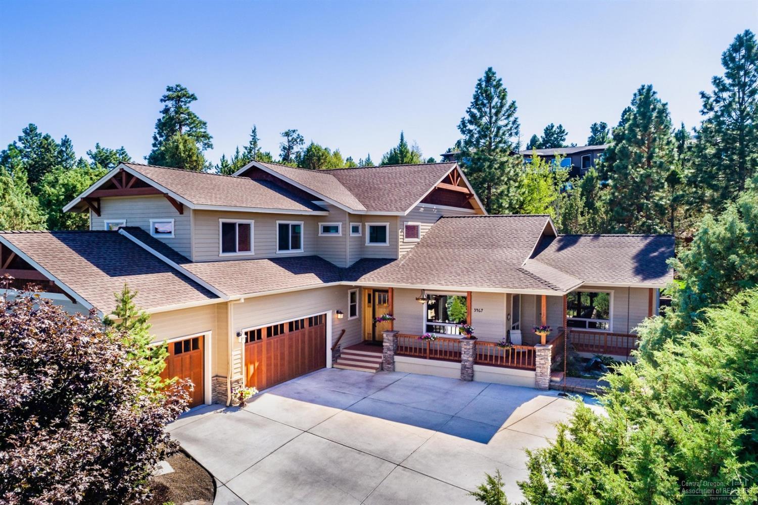 This beautiful Awbrey Park home is loaded with everything a family could want! It is an open and bright main level floor plan with a main level master suite, laundry room, powder room, great room (kitchen, living & dining) & an added bonus living room. It features wood wrapped windows, hand troweled walls, surround sound, wood, carpet and slate flooring, slab kitchen bar/island, large dining area and a slider out to use your lovely, private back patio and yard. There are 5 bedrooms total: 1 master suite downstairs, and a 2nd master suite + 3 more bedrooms and a bathroom upstairs and an oversized 3 car garage. Relax on the private front porch listening to the water feature and taking in the views. The driveway features a large turn around and parking space and it is all heated and can be turned on with your phone remotely, so you never have to worry about snow shoveling upon your arrival home.