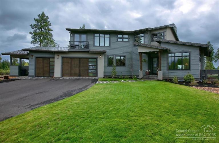 A rare opportunity to own a luxury contemporary home in one of Bends premium locations. Enjoy privacy, views and proximity to all West side amenities. Flooded with light the main level offers a stunning great room with a top of the line kitchen, office & bedroom suite. On the upper level are two additional bedroom suites and a bonus room. An oversized 3 car garage has a portion converted to a finished exercise room, great storage & a dog wash station.