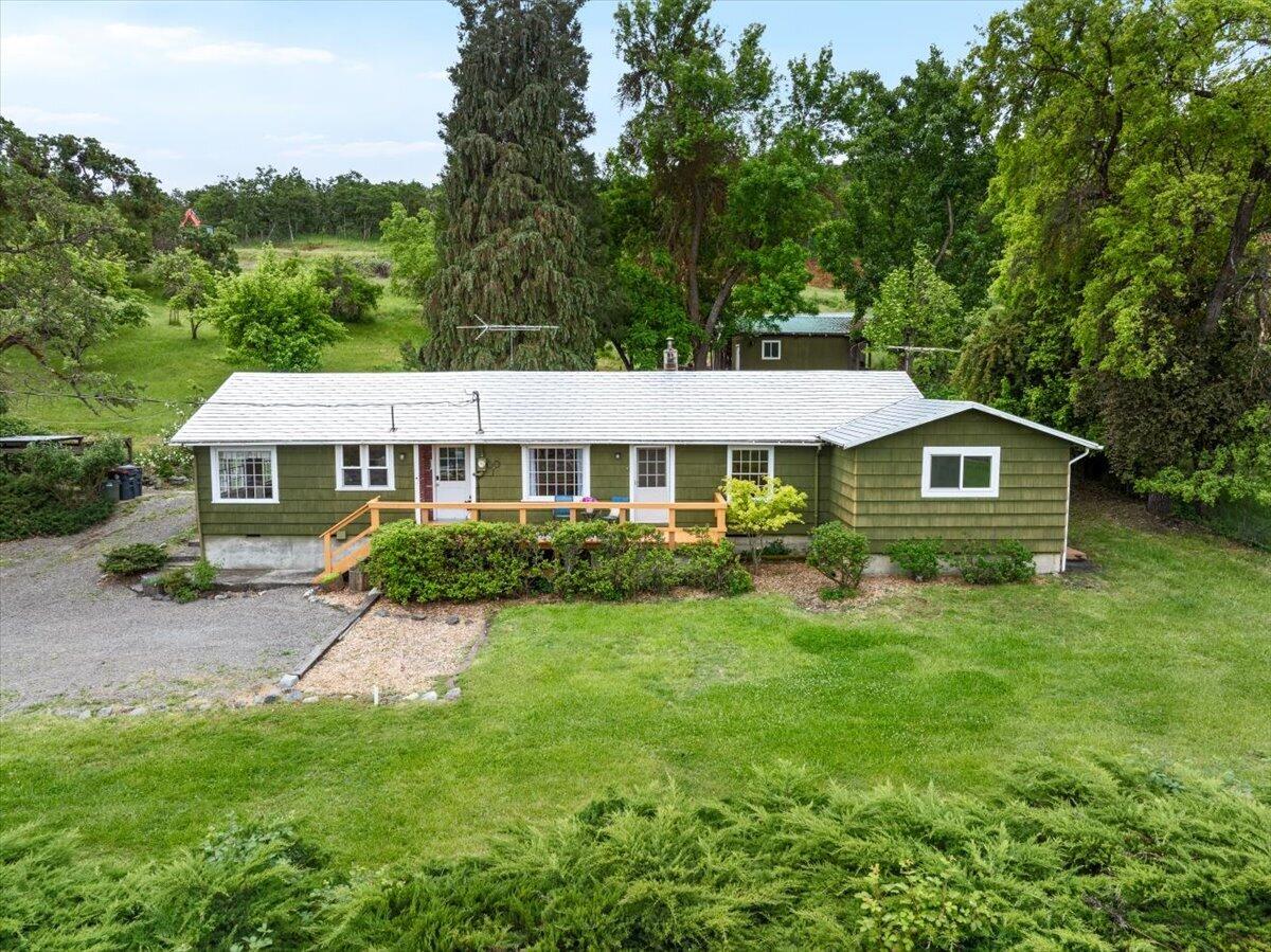Peaceful Country Living, Minutes from Town!!... Lovingly owned by the same family for nearly seven decades, this 4BD/2BA Home rests on almost 5 gently sloping acres in a rural setting just outside Medford's urban growth boundary, with potential to divide per seller ... buyer to perform due diligence. Take in sweeping valley views and twinkling city lights below!!

Features include hardwood/simulated wood flooring, electric & oil heat, and all appliances. TID (Talent Irrigation District) irrigation newly piped underground (replacing ditch) ideal for gardening or hobby farming.... Established Orchard offers apple, pear, and plum trees. Multiple outbuildings, city sewer, and a private well with purification and reverse osmosis complete this property...  

Shown by Appointment Only; No drive-bys or trespassing without an agent present.