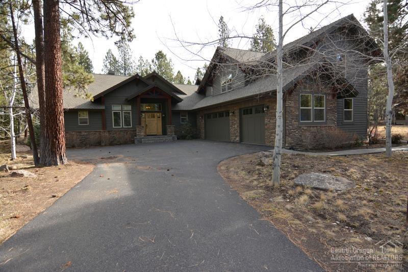 Caldera Springs turnkey rental. This home features 6 bedrooms with 5 masters, 3 on the main level, great room w/vaulted & beamed ceiling, wood floors, floor to ceiling fireplace and slated entry. Kitchen has breakfast bar, slab counters, knotty alder cabinets & stainless appliances. Large family room upstairs to spread out during large family gatherings. Views of Firglass lake, private hot tub and extended living on outdoor decks & patios.