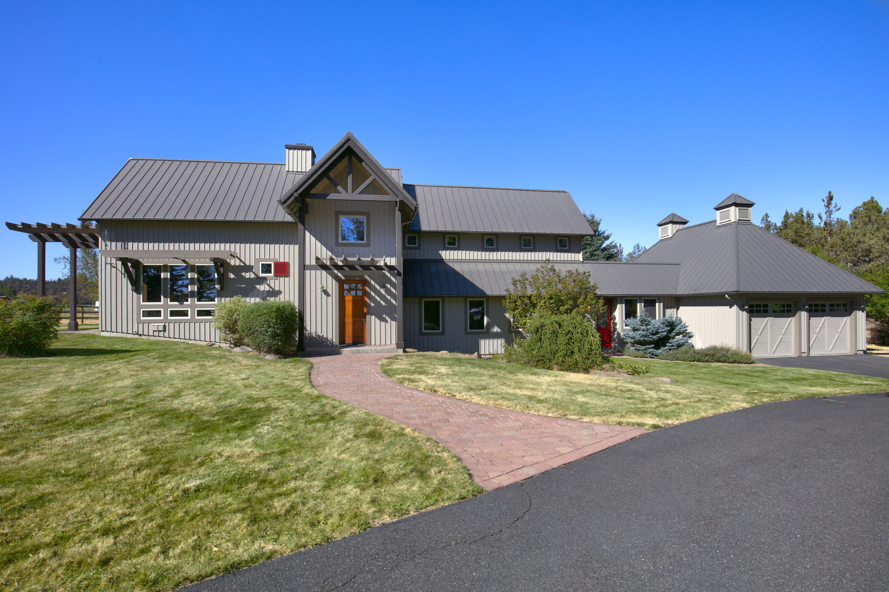 This Tumalo estate is truly one of a kind with custom woodwork and finishes throughout. Cascade mountain views from every window that also overlooks beautiful pastures. Gourmet kitchen with top of the line appliances, pantry, tons of built-ins and access to the paver patio. Beautiful living room with wood beams and large stone wood burning fireplace. Two master suites, one up with a loft office and large on suite.  Bring your horses, llamas, goats and family to this magical property that is set up for a number of different options. The front half of the property is available to grow your own hay.  Multiple fenced turn outs each having it's own shelters and heated auto waters. The original barn provides plenty of storage as well as two additional stalls.  Triple car garage, shop and third bedroom can easily be added onto the home.  Property has a recorded view easement that will protect your view! Please call for your personal tour of this once in a lifetime property.