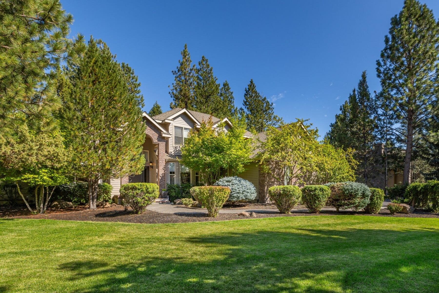 Nestled in The Gated Awbrey Glen Neighborhood, this beautiful home is on a half acre of wooded, landscaped retreat.As you step inside  this Northwest Styled home, you enter a spacious entry, with large dining room to the right, large living, great room and open kitchen area. This kitchen is perfect for entertaining, central breakfast island, ample cabinets, Wine Cooler and Pantry.All major appliances included.  Main floor Master, with dual vanities, Jacuzzi Tub, unique large shower.Powder room and Den also on main floor. Upstairs are two bedrooms, full bath with shower. And a Library, sitting room with balcony overlooking the main living area. Large decks are great for entertaining.  Attached three car garage has ample storage. Welcome to Awbrey Glen, an inviting time in one of Bends Premier Gated Communities
