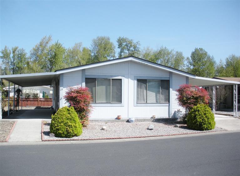 Nice Silver Crest home located in Talent's desirable 55+ Mountain View Estates. Very spacious living room with lots of windows, a built-in china cabinet & dining area. Roomy kitchen has a new dishwasher & refrigerator. Both of the good sized bedrooms have a walk-in closet. The master bath has double sinks, a skylight & a walk-in shower. There is a covered porch to relax on, an attached storage shed, covered carport, new heat pump in Oct. 2013 & an easy care yard. For those of you with a green thumb, there is a sunny spot for a garden. Park rent includes access to the clubhouse, swimming pool, sauna, pool tables, Jacuzzi spa, recreation hall with a full kitchen, library & pays for your sewer, trash & water. Lots of opportunity to meet new friends at all of the numerous social events. Park rent is $440 month