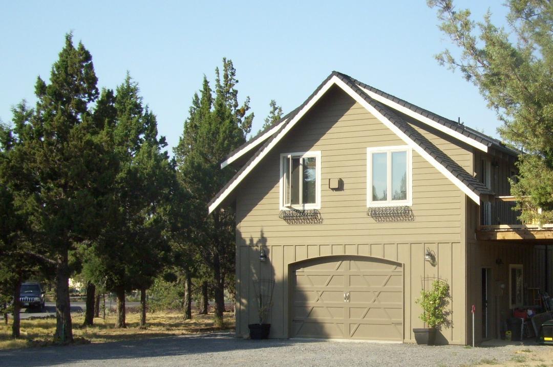 Fantastic buildable 2.6 acre lot in Old Deschutes!! Current home has 2 bedrooms, 1.5 bathrooms. One bedroom downstairs with half bath and washer/dryer. One bedroom upstairs with a full bath including a soaking tub. Vaulted ceilings in the great room. Home has A/C, large storage closet and kitchen pantry upstairs. Available propane hookup for BBQ on deck. Property backs the canal and has 0.5 acre of irrigation rights. Already set up for gardening with raised beds. Live in current home and enjoy the acreage or perfect set up to live in while building your dream home on this level lot. So many opportunities with this property. Close to Pine Nursery, Ponderosa Elementary, Eastside eateries and more!