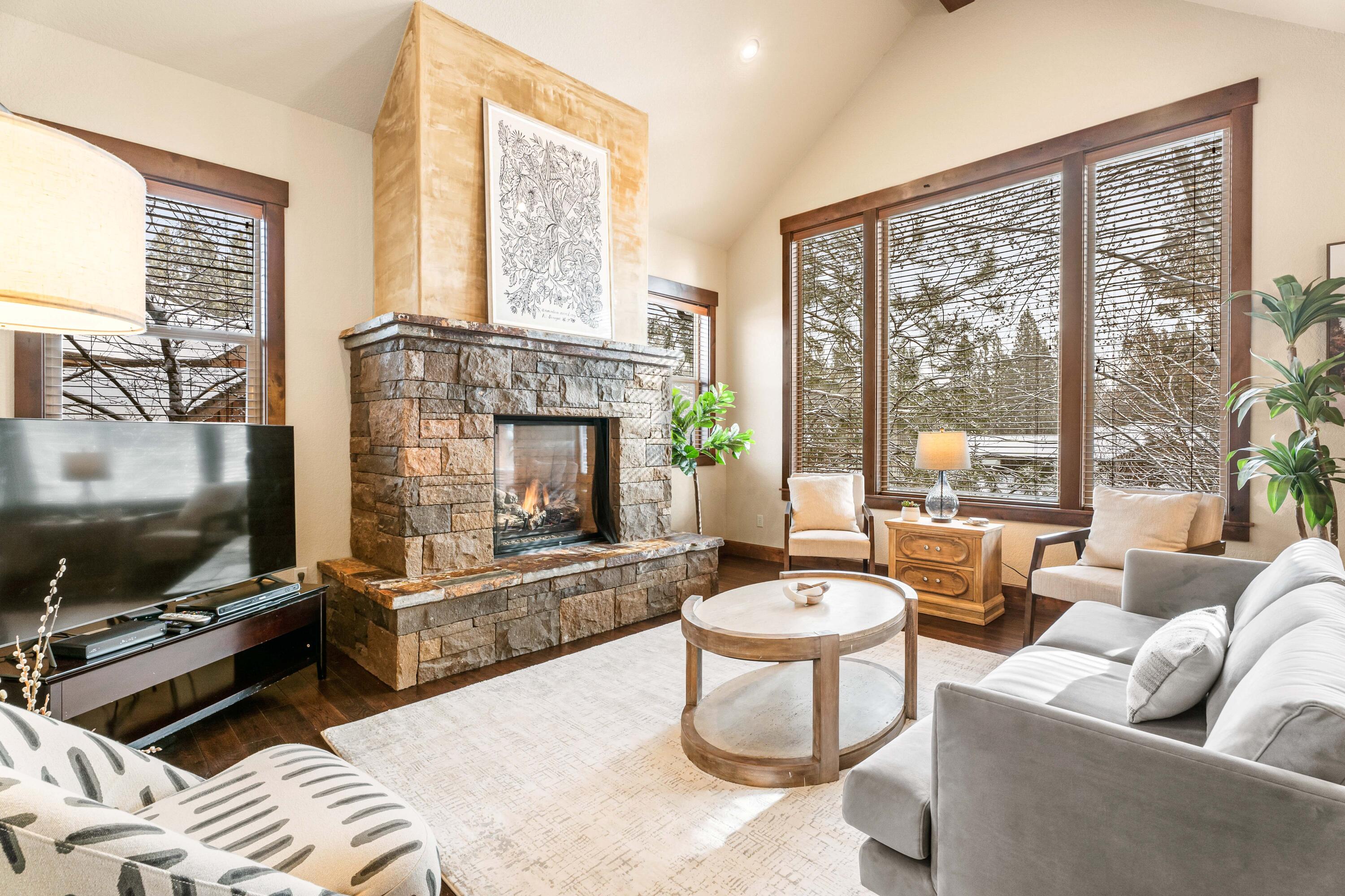 This coveted Short Term rental permitted townhome allows new owner to spend time throughout the year and also receive income for when it is not in use. Located in the westside gated Points West subdivision, this luxurious townhome offers 4 beds, 4.5 baths, with primary suite on main floor. Designer selected finishes, gourmet kitchen w/ leathered granite countertops, hand scraped wood flooring, and tile upgrades throughout the home. Downstairs features a cozy stone fireplace, glass french doors to office, and paver patio overlooking Duck Landing water feature. Upstairs, find 3 oversized bedrooms, all with their own bathrooms. Location is an outdoor enthusiasts paradise with Mt. Bachelor and Cascade lakes only minutes away. Nearby mountain biking trails & paved U-haul bike trail to ride safely to town, and a trail to walk along the Deschutes River is located within the community.