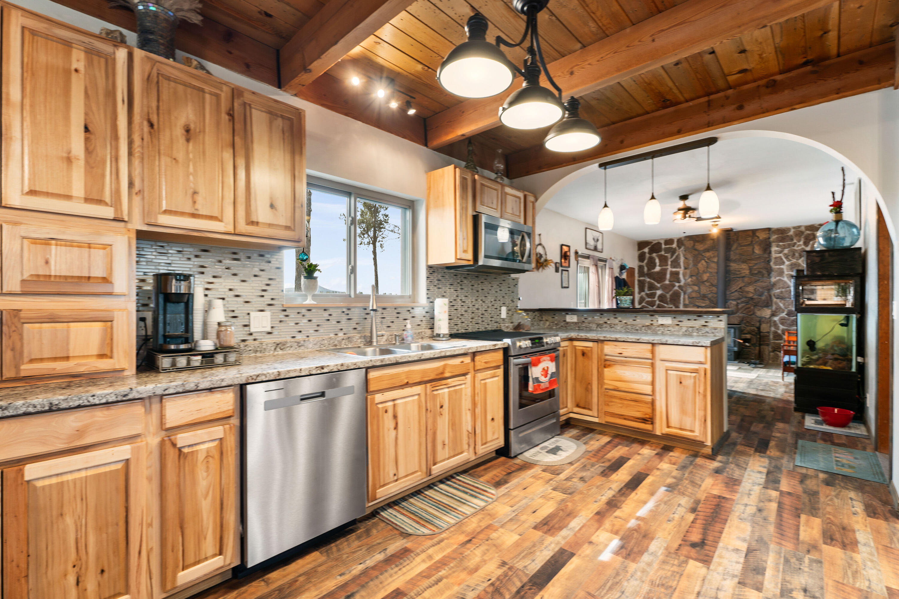 Envision a peaceful haven where the little Deschutes River winds through 28+ acres of breathtaking natural beauty. A gorgeous estate that offers a rare combination of picturesque scenery with functional ranching facilities. It is truly a horse and cattleman's dream. This 3-bedroom, 2 bathroom, 1877 sq ft. property features spectacular views from almost every room and has beautiful wood beam vaulted ceilings.  The truly custom home also includes hidden room off of the primary bathroom, with built-in safe and plenty of storage. This ranch offers a barn, concrete cattle working station, corrals, tack room, hay storage, coops and more, all with nearby forest access and modern conveniences within reach. It's a one-of-a-kind ranch that has so many amenities, it is a must see. It is absolutely a dream property!