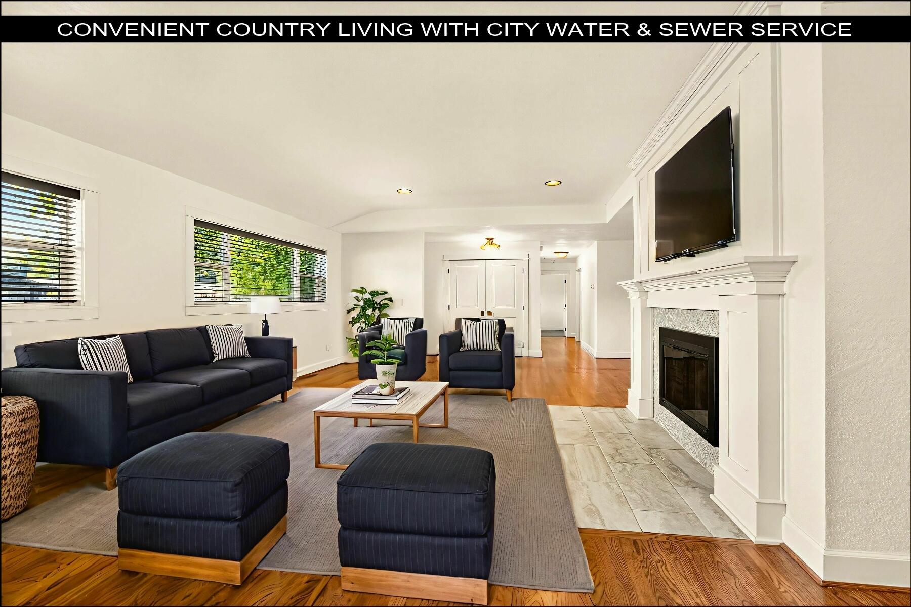 Nicely updated single level home ideally positioned between Medford & Jacksonville on a .51-acre lot in sought-after Pioneer Subdivision. The location offers the best of both worlds: near-town convenience paired with a peaceful rural setting. Dependable public water & sewer add ease of living, while the half-acre lot provides space for gardening, recreation, & gatherings. The single-level design spans 2,390 sq ft with 3 bedrooms, 3 baths, a den/office, & a bonus room. Thoughtful updates completed in 2017/2018 include a modern kitchen, a private primary suite addition, updated bathrooms, beautifully refinished hardwood floors, tile & quality carpeting, wood fireplace/mantle, HVAC system, comp roof, & vinyl windows. Step outside to a fully fenced yard shaded by mature trees, a generous patio for entertaining, & ample parking options including a gated 26' X 60' RV area & paved off-street spaces. A recently added storage building offers flexibility for hobbies, projects, or a future shop.
