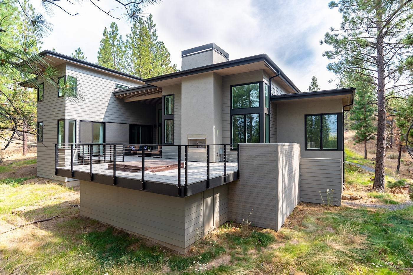 This modern custom masterpiece in Tetherow is everything you've been looking for! 4 bedrooms, 4 bathrooms and a Bonus Room highlight this functional floor plan that lives much larger than the square footage. Main Level stunning Master Suite with private views and access to the back deck and Hot Tub. Gorgeous Designer Kitchen with Open Concept Floor Plan. The home takes advantage of its private setting while offering an abundance of Natural Light. Stunning outdoor space. 3 car Garage with extra storage.