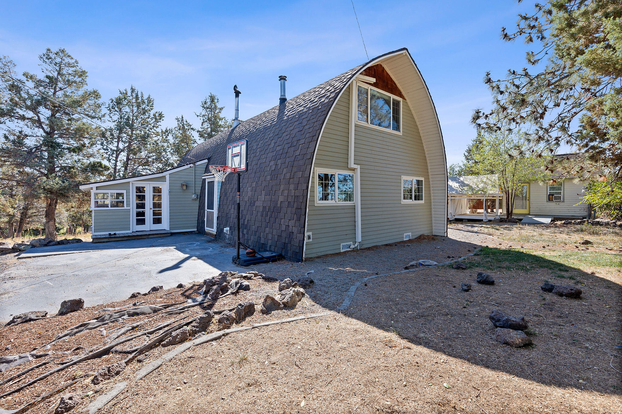 Not the atypical home in a neighborhood, this beautiful A-Frame house on two acres with three bedrooms and two baths is ready to be your new home. The T&G woodwork inside is a must see. Kitchen shines with a white farmhouse sink and white quartz countertops. The cable railing system on the banister adds a sleek contemporary aesthetic. Make the outside your personal oasis with multipurpose outbuildings, large garden space, 0.4 acres water rights and room to customize all. Views of Mt Jefferson can be seen from the outside fire pit. Schedule your showing today.