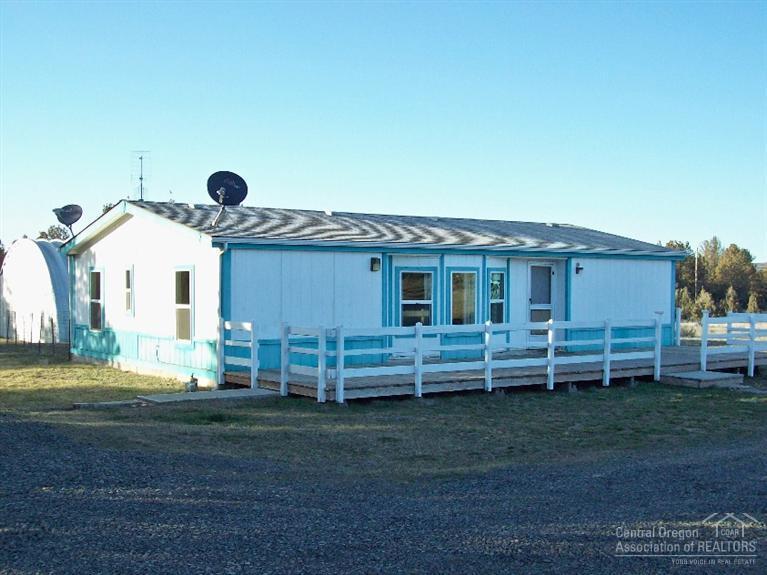 Bring your horses to this 5.8 acre corner lot in PLA 1. This property not only includes an 1182 sq ft 3 bedroom 2 bath home, but also a large quonset hut, chicken coop, horse stalls, and loafing sheds. It is partially fenced with separately fenced pastures. All new vinyl windows were recently installed New flooring throughout. Freshly painted inside.